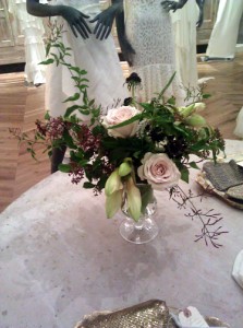 Loose and gardeny floral centerpiece in muted tones.