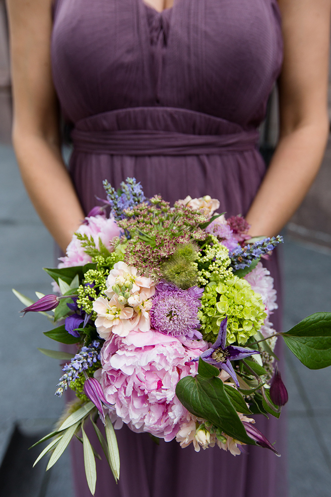 Spring bridesmaid's bouquet with peonies, lavender, and olive with dusty purple bridesmaid's dress.