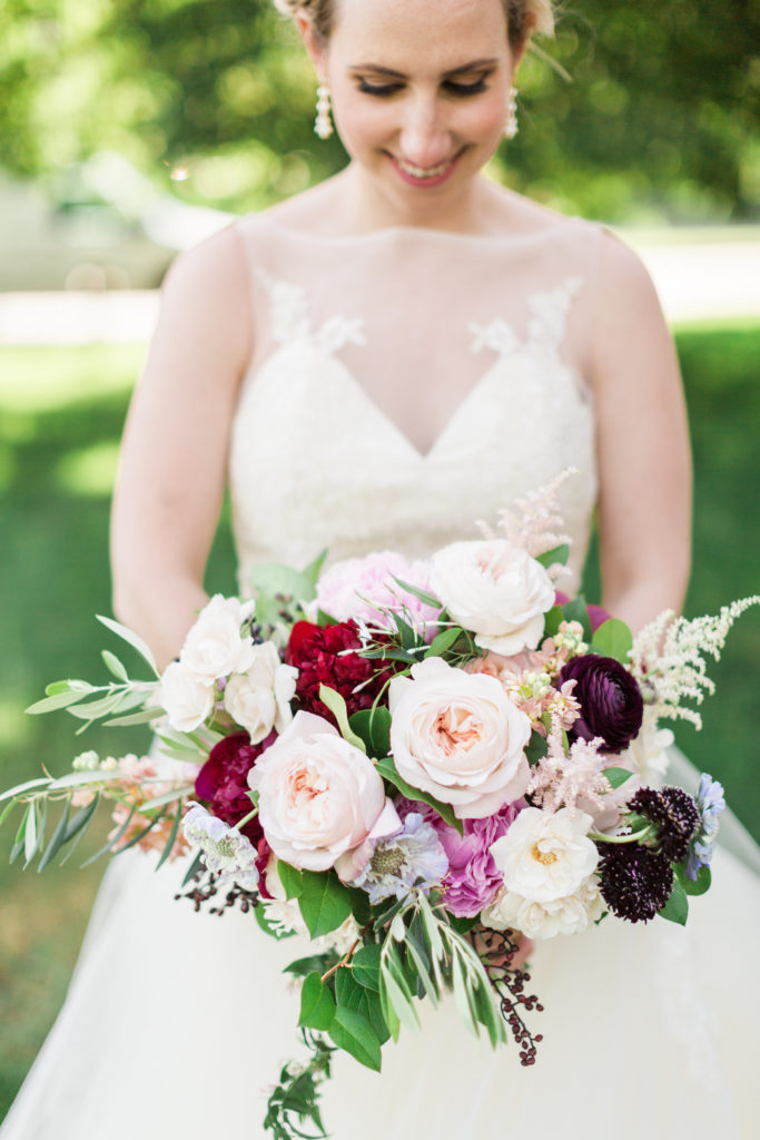 For this colorful spring wedding at Halls of Saint George, we used a colorful palette that included peonies, garden roses, raunculus, scabiosa, and astilbe. 