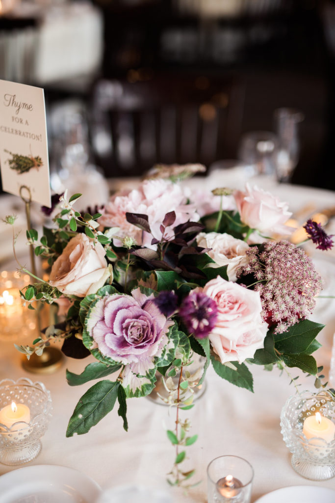 wedding centerpiece in eggplant and blush