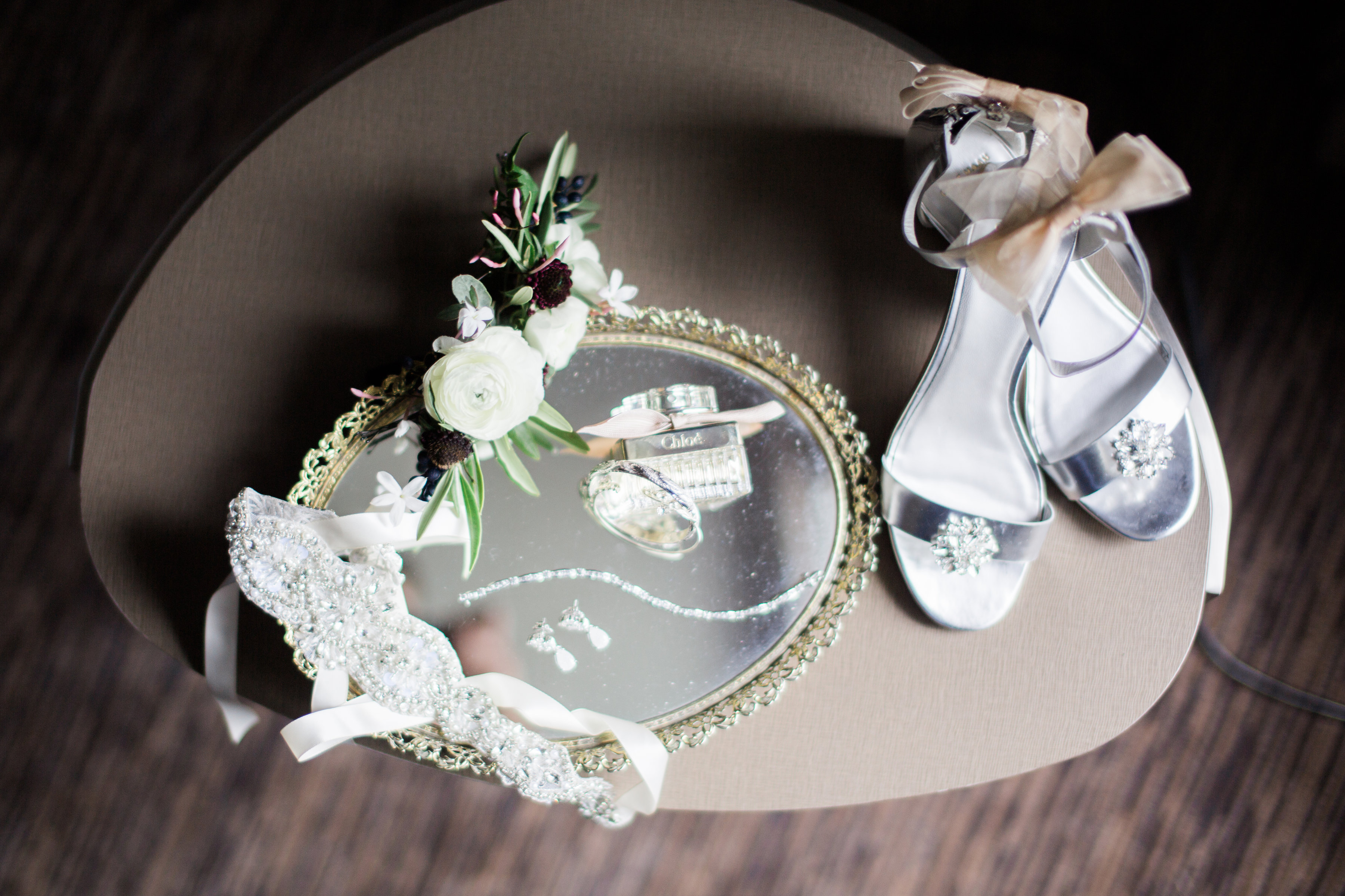 wedding details with shoes, hair flowers, jewelry