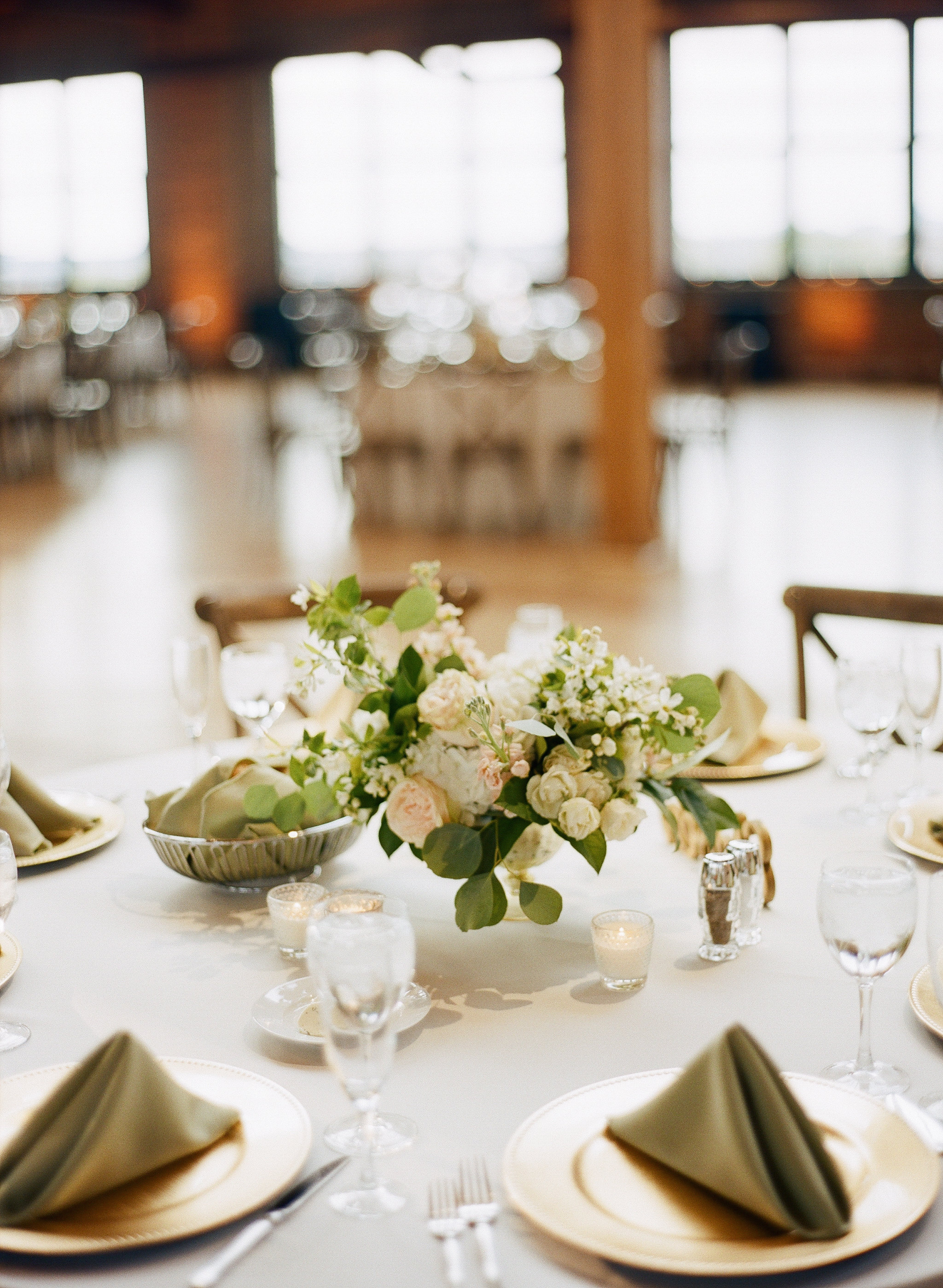 White floral rose centerpiece for wedding venue at Bridgeport Skyline Loft. 