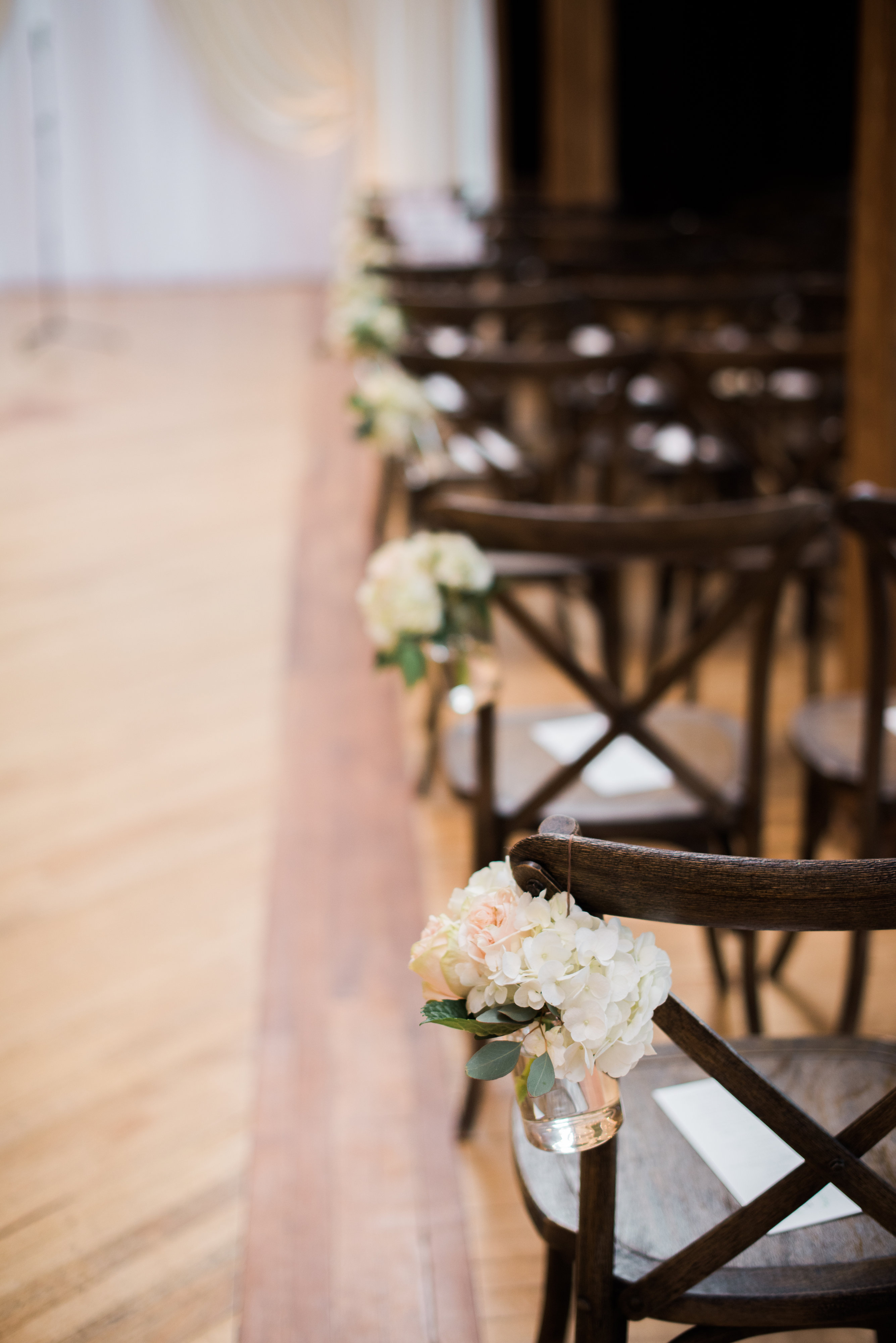 Wedding ceremony aisle flowers at Bridgeport Art Center Skyline Loft in Chicago.