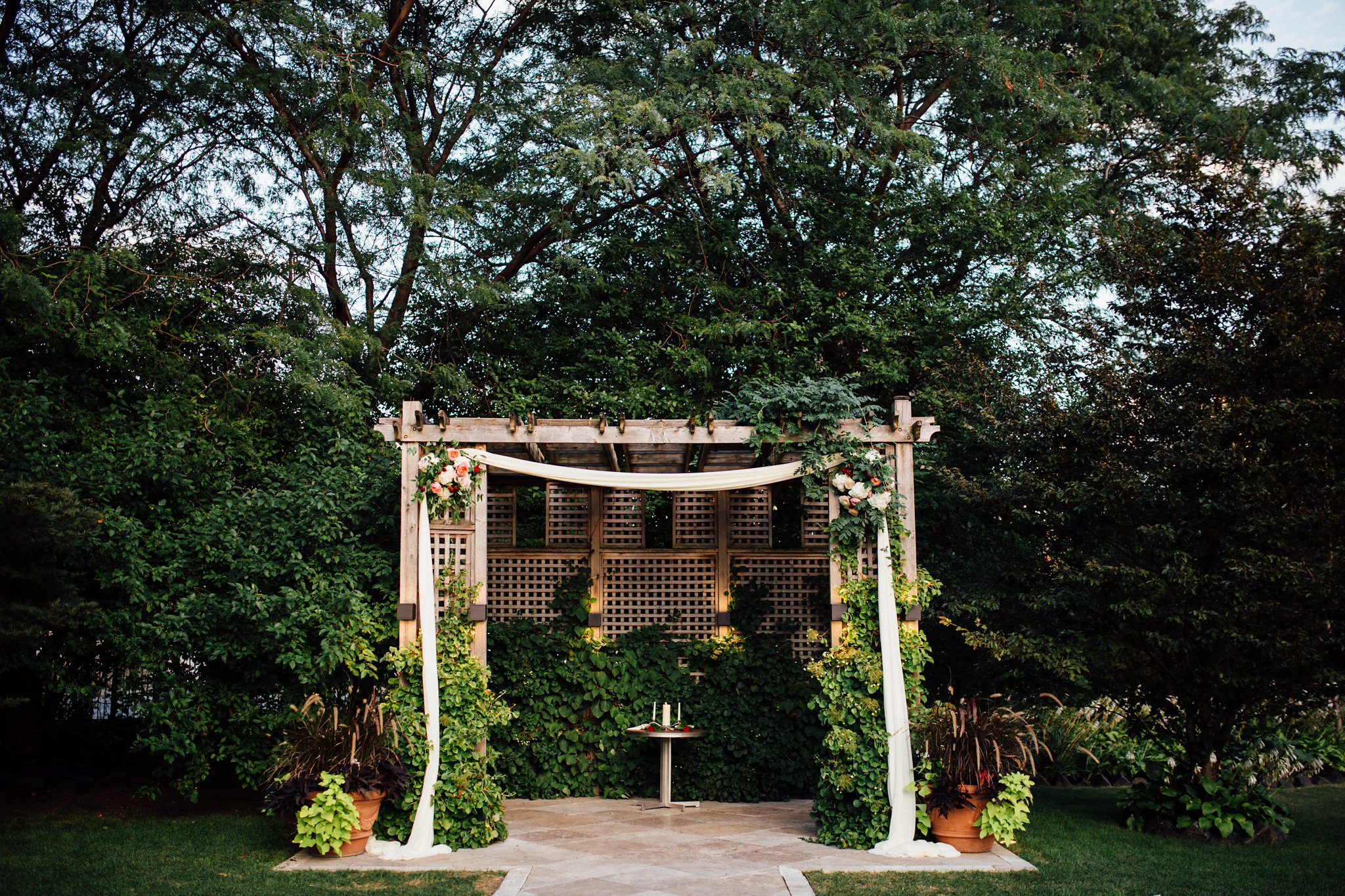ceremony arbor decoration with flowers and flowy fabric at Galleria Marchetti in Chicago