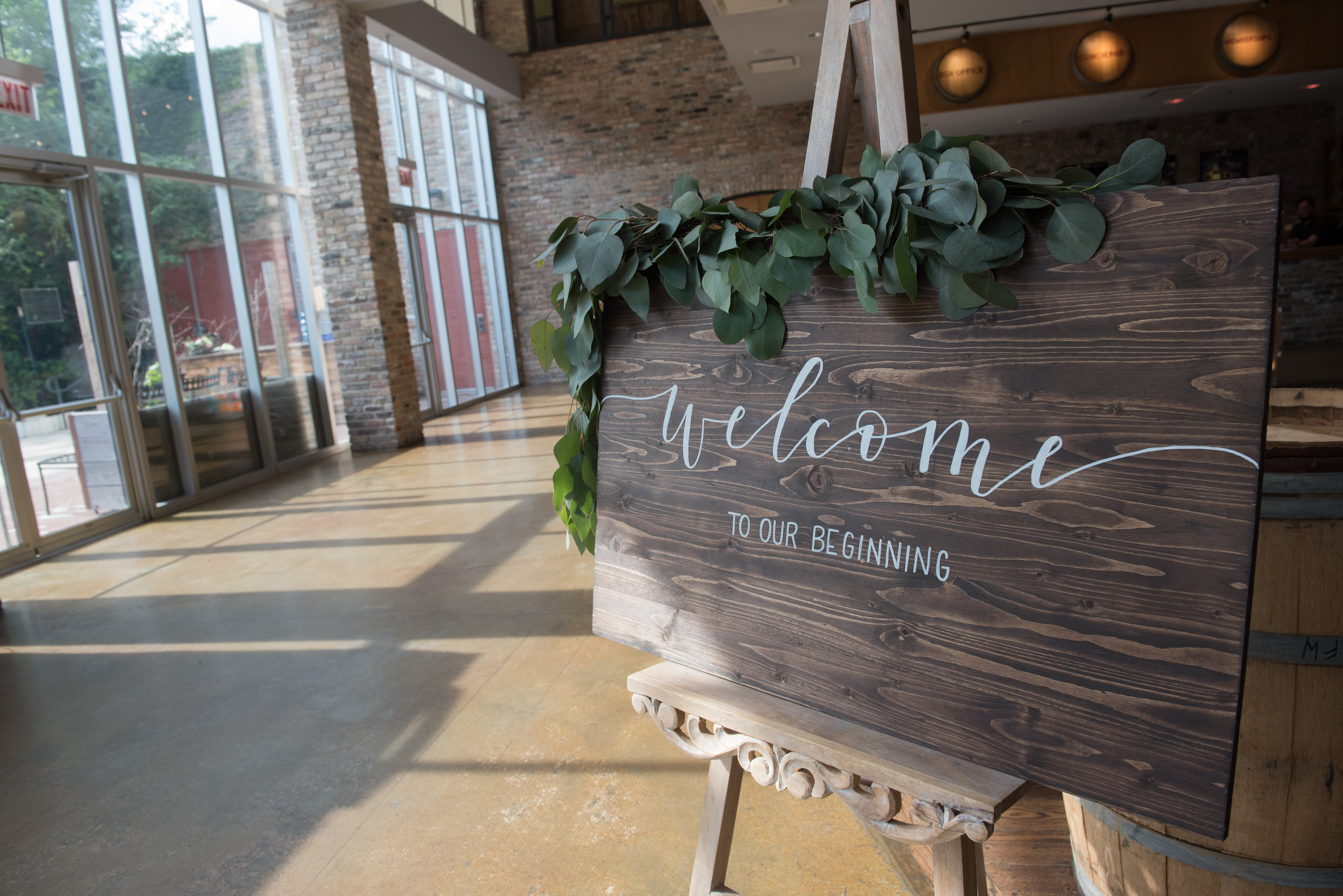 Welcome to our beginning rustic wedding sign with foliage at City Winery.