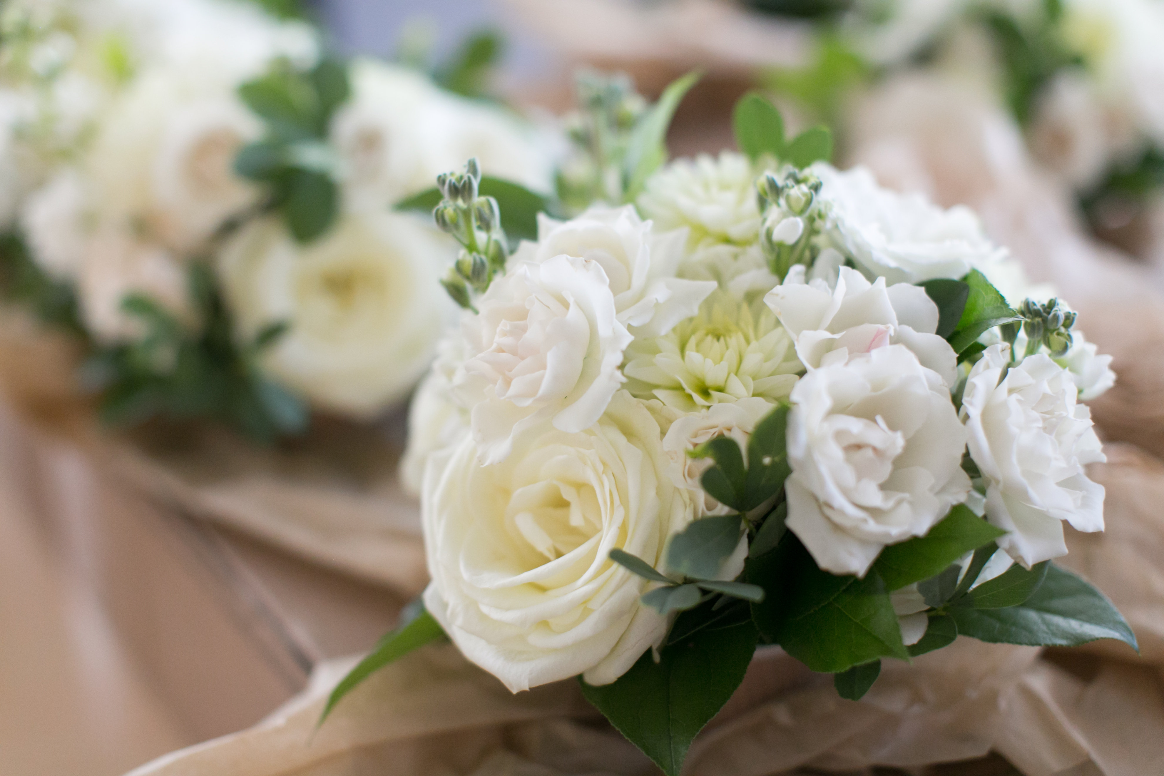 Ivory summer wedding bouquet with dahlias and garden roses.