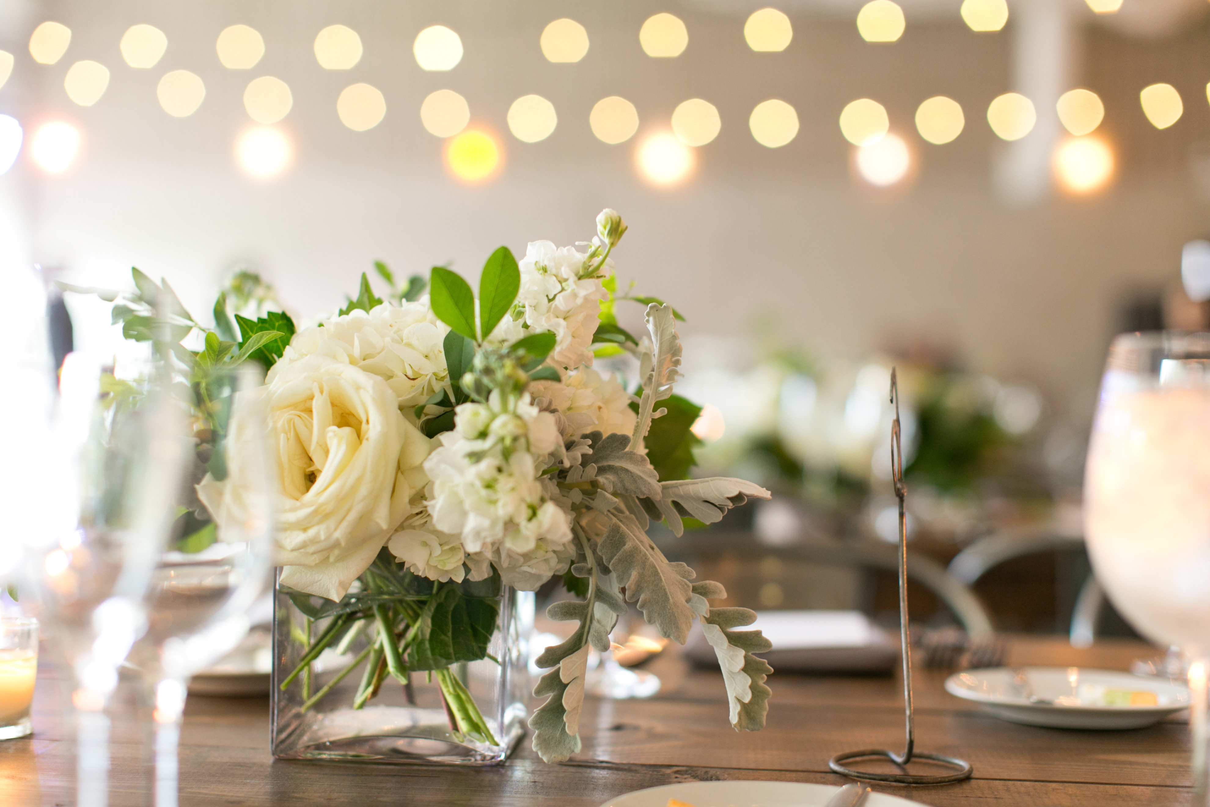 Ivory wedding reception bouquets with garden roses at Ignite Glass Studio Chicago.