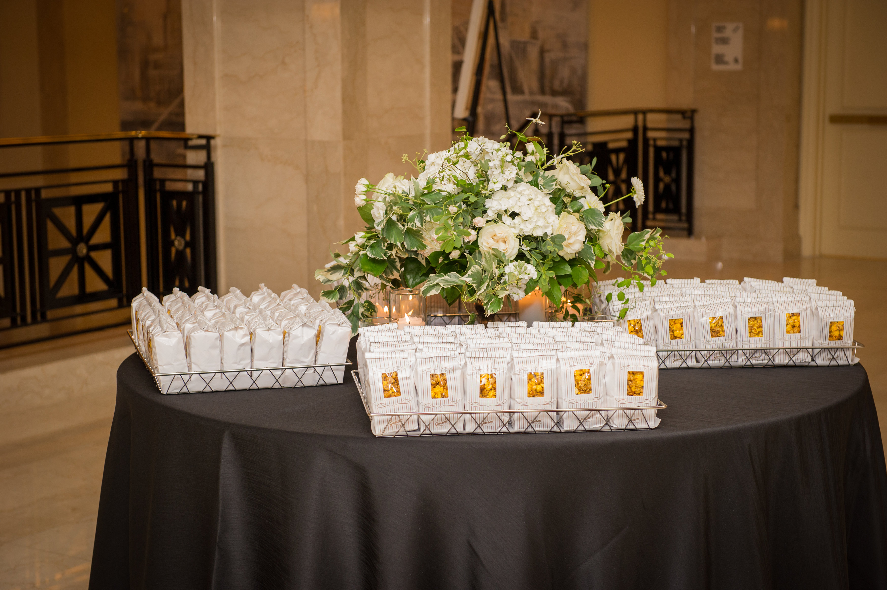 Autumn wedding at JW Marriott Chicago with ivory and green rose arrangement with popcorn.