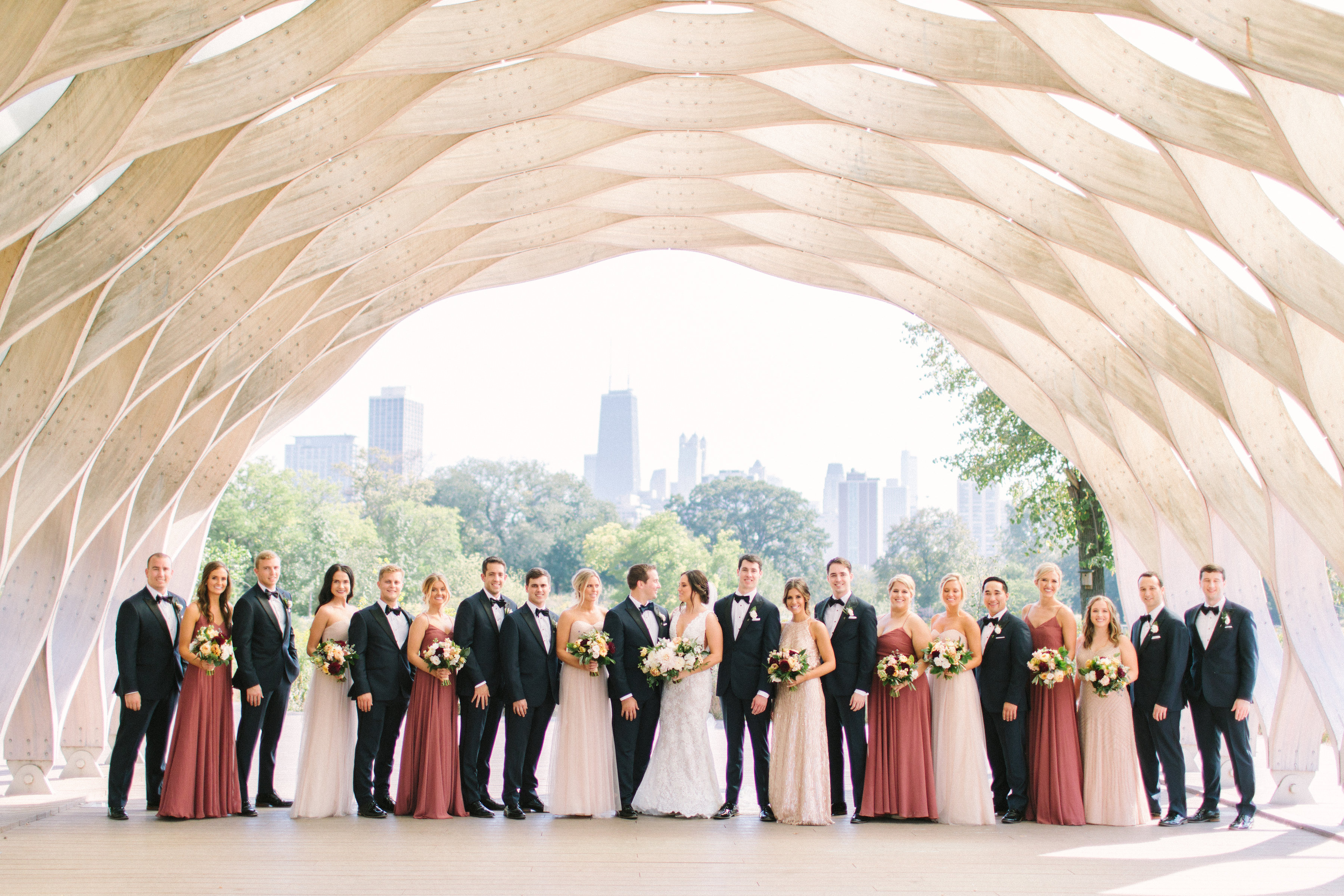 Chicago wedding party in deep rose and blush bridesmaids' dresses at Lincoln Park Zoo honeycomb