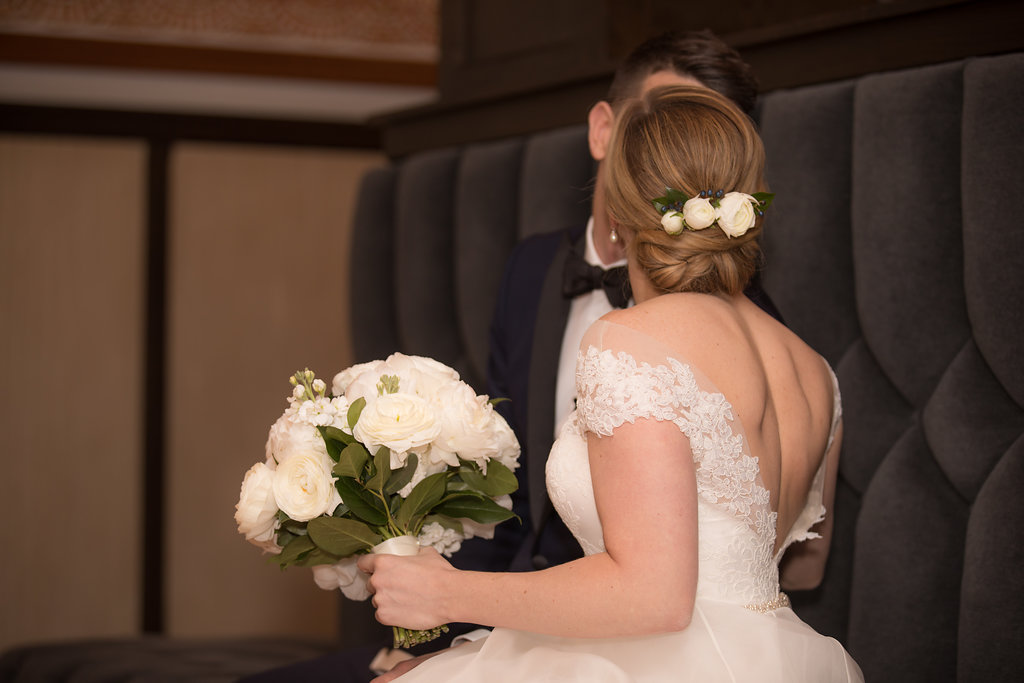 Monochromatic ivory bridal bouquet and flower hair piece. 