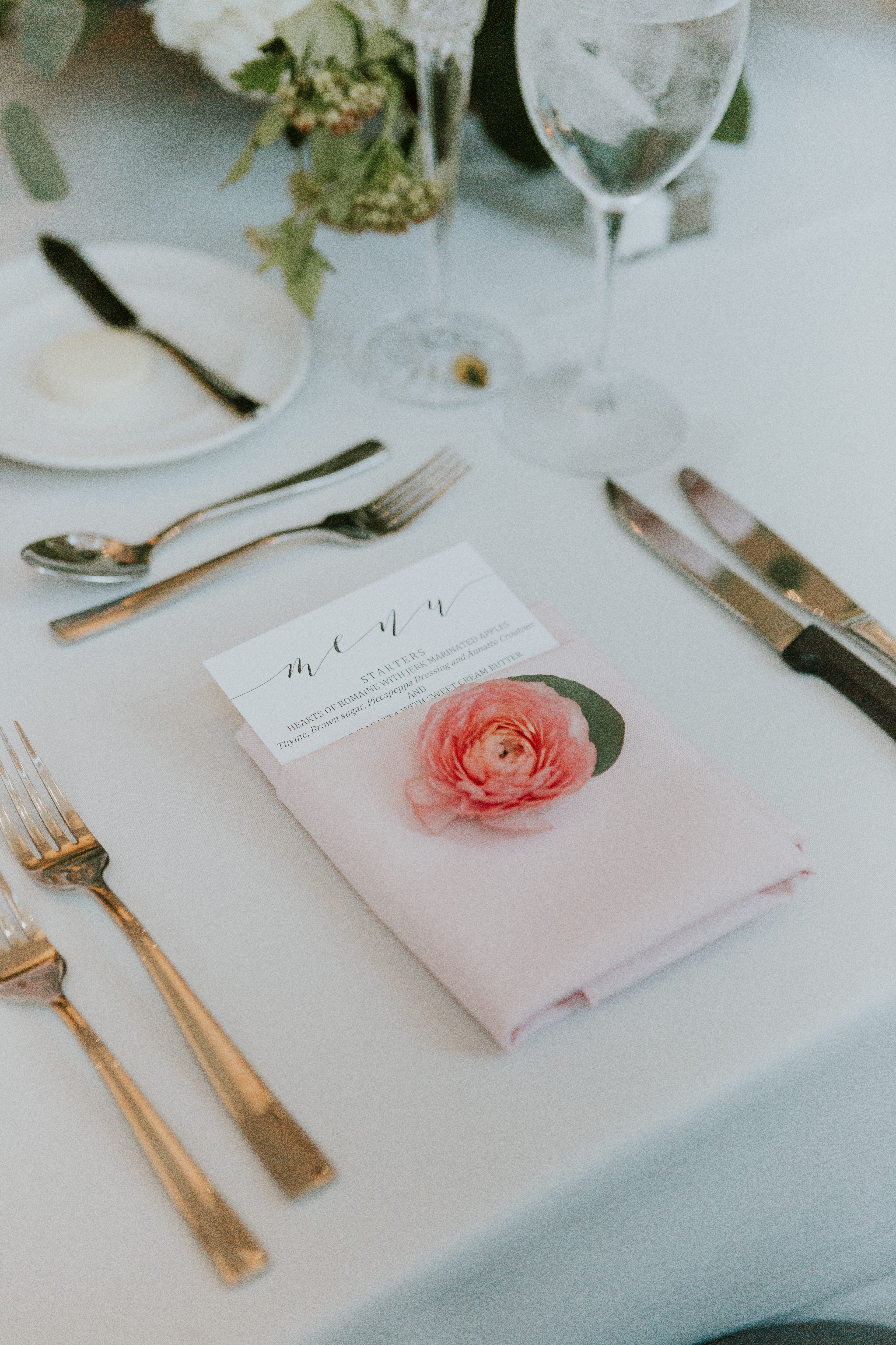 Summer wedding reception details at 19 East with blush napkins and pink ranunculus.