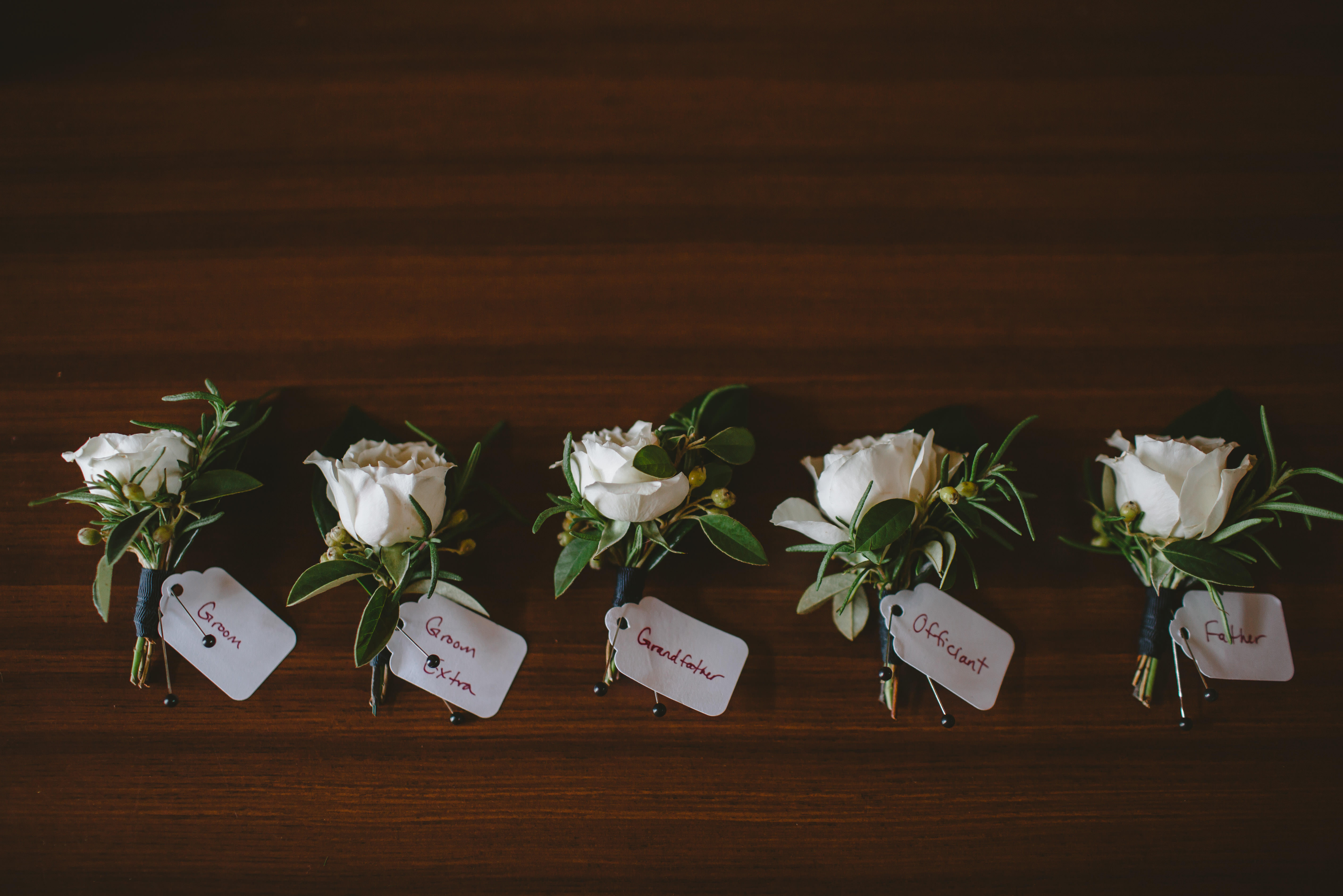 Ivory spray rose boutonnieres.