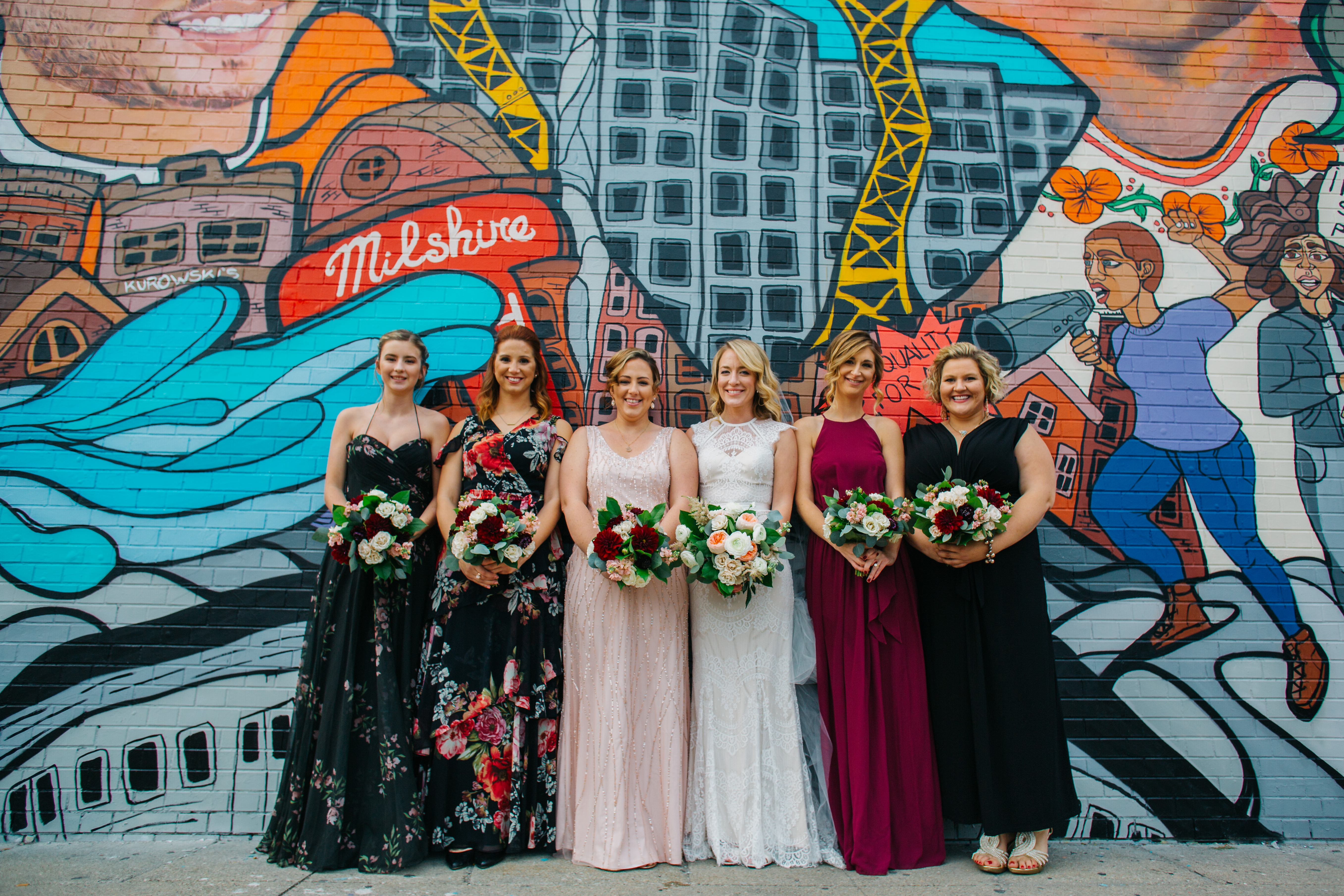 Chicago bridal party with bouquets of garden roses, burgundy dahlias, white ranunculus, astilbe, and pink stock.
