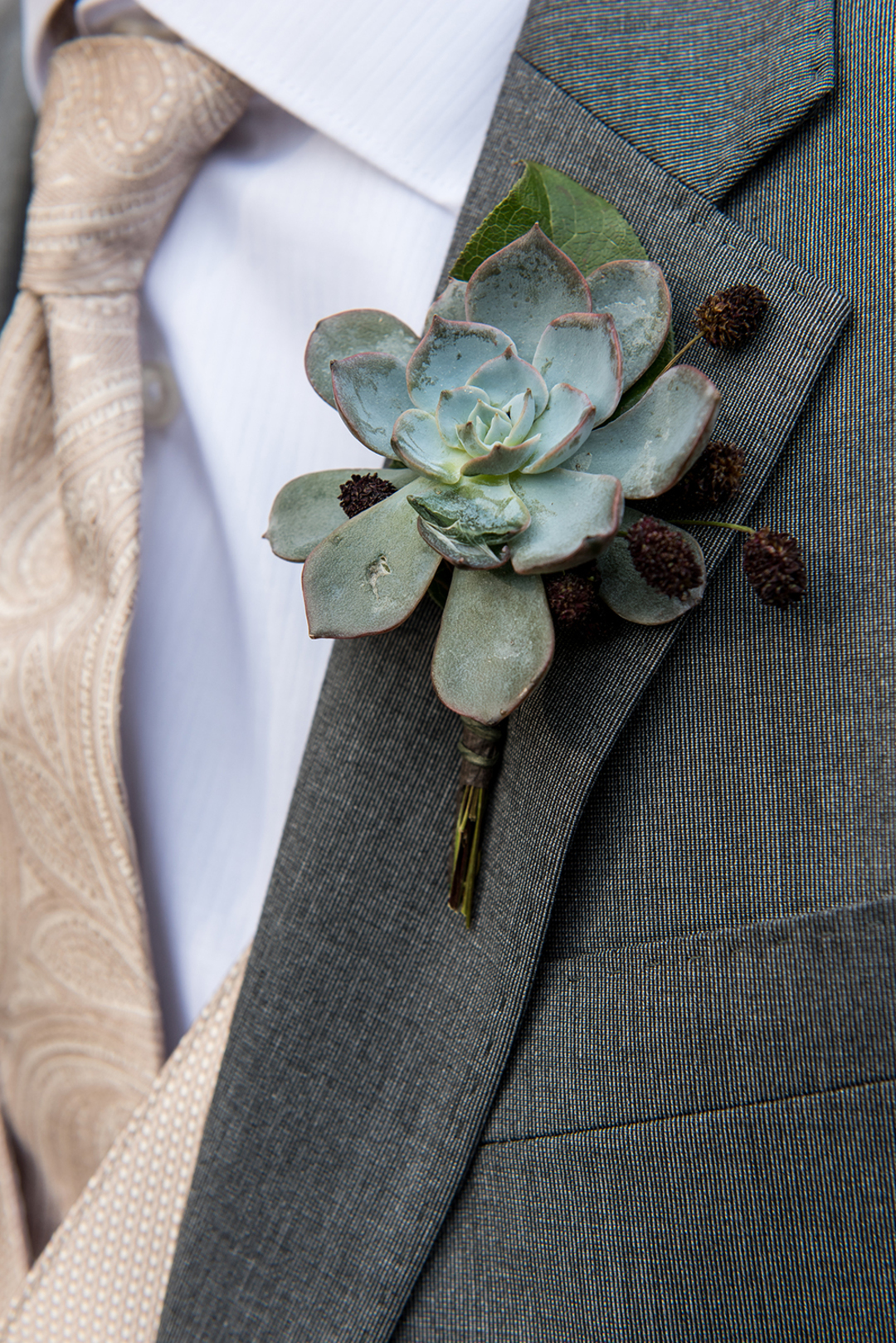 Summer wedding boutonniere with succulent. 