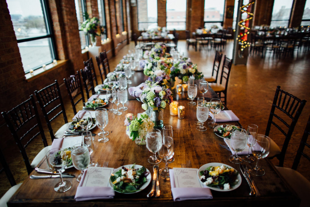 Table setting in pale purple and green for spring wedding at City View Loft in Chicago.