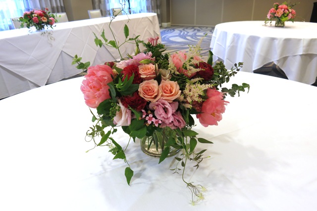 Spring wedding centerpieces with peonies, roses, clematis, astilbe.