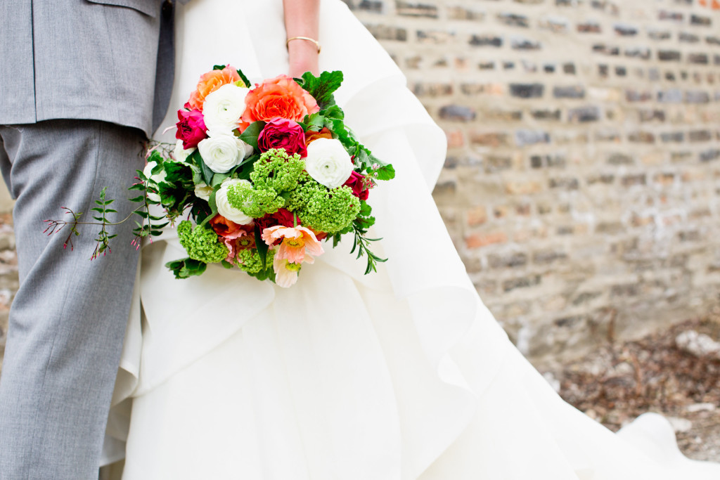 Spring wedding bouquet with ranunculus, poppies, snowball viburnum, jasmine