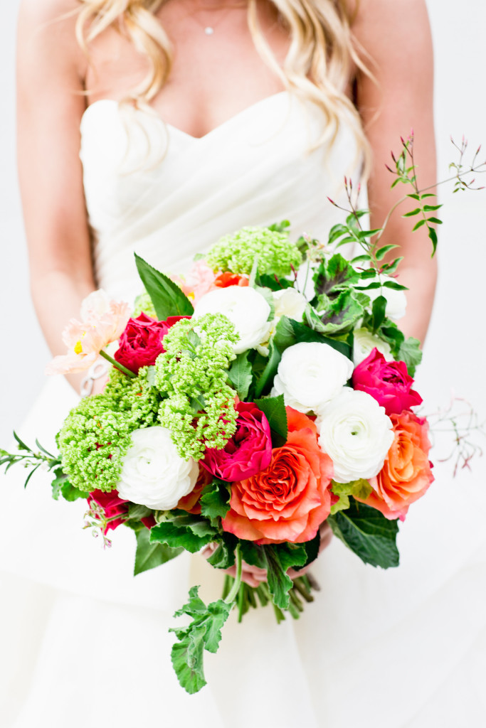 Spring wedding bouquet with snowball viburnum, ranunculus, garden roses, jasmine, scented geranium
