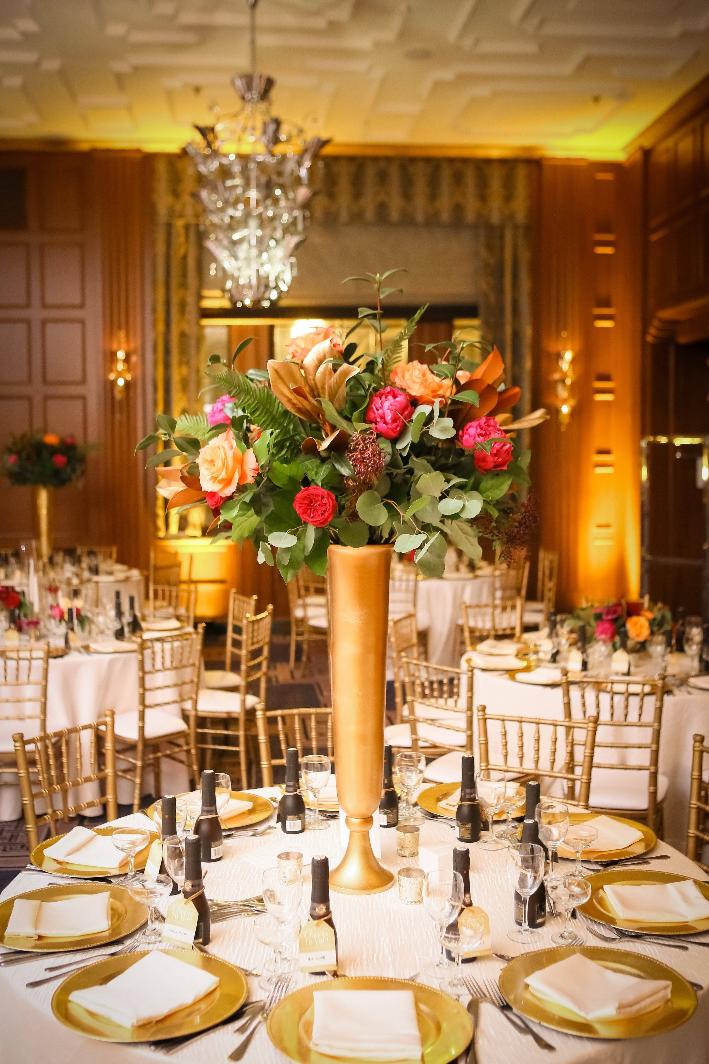 Tall winter wedding centerpiece in bold colors