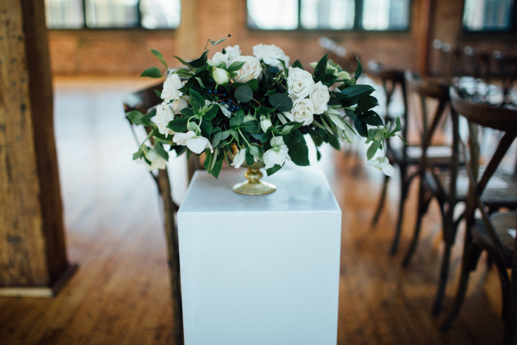 Flowers by Pollen. Photography by Tim Tab Studios. Wedding centerpiece on pedestal for ceremony aisle decor.