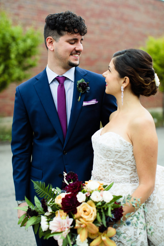 fall wedding bride with bouquet and groom in navy blue suit