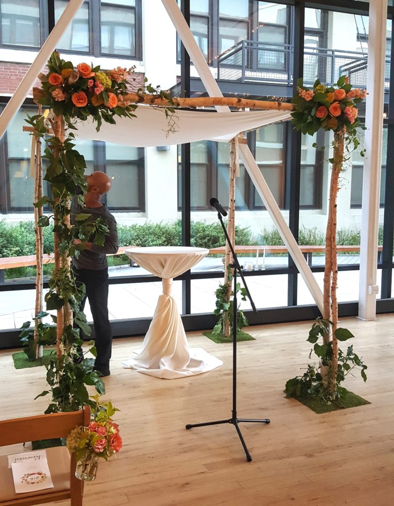 Birch chuppah decorated with foliage and flowers no floral foam