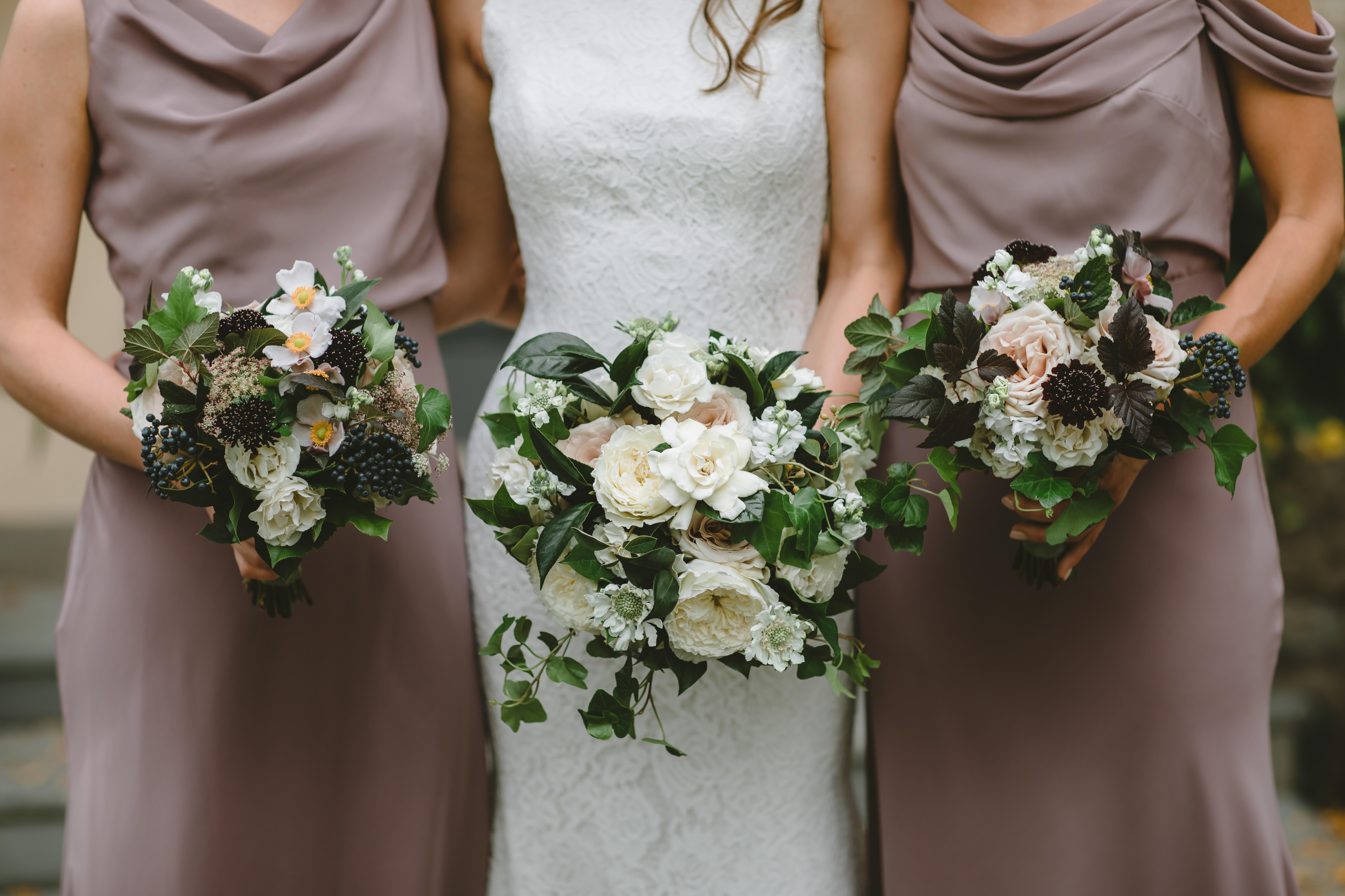 Mauve, burgundy, navy, blush, and ivory bridesmaids bouquets with fig bridesmaids' dresses from Jenny Yoo