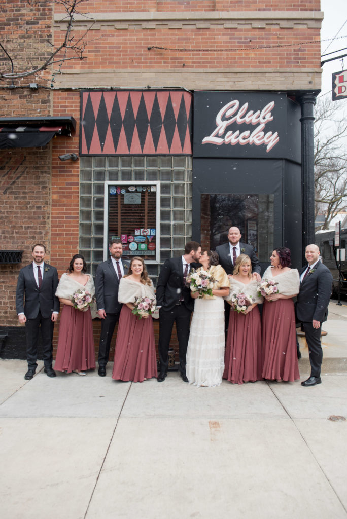 Wedding party at at Club Lucky in Chicago for Salvage One winter wedding, with a bridal bouquet of garden roses and eucalyptus.