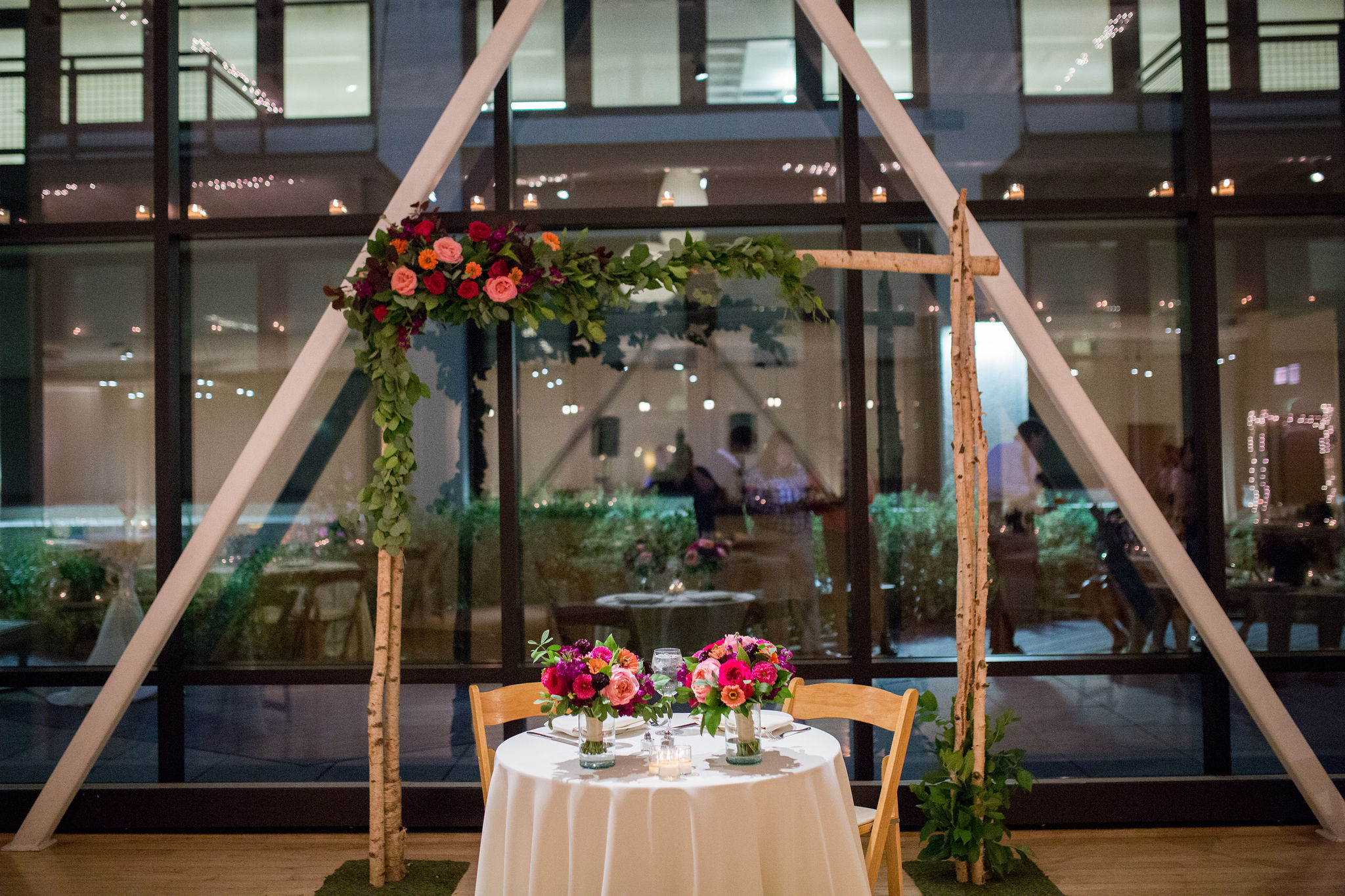 Birch arch behind sweetheart table at Greenhouse Loft in Chicago.
