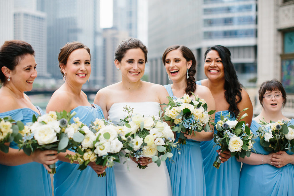 Summer bridal party for celestial outdoor wedding at Adler Planetarium with ivory bouquets of garden roses, ranunculus, eucalyptus, succulents, and tweedia.