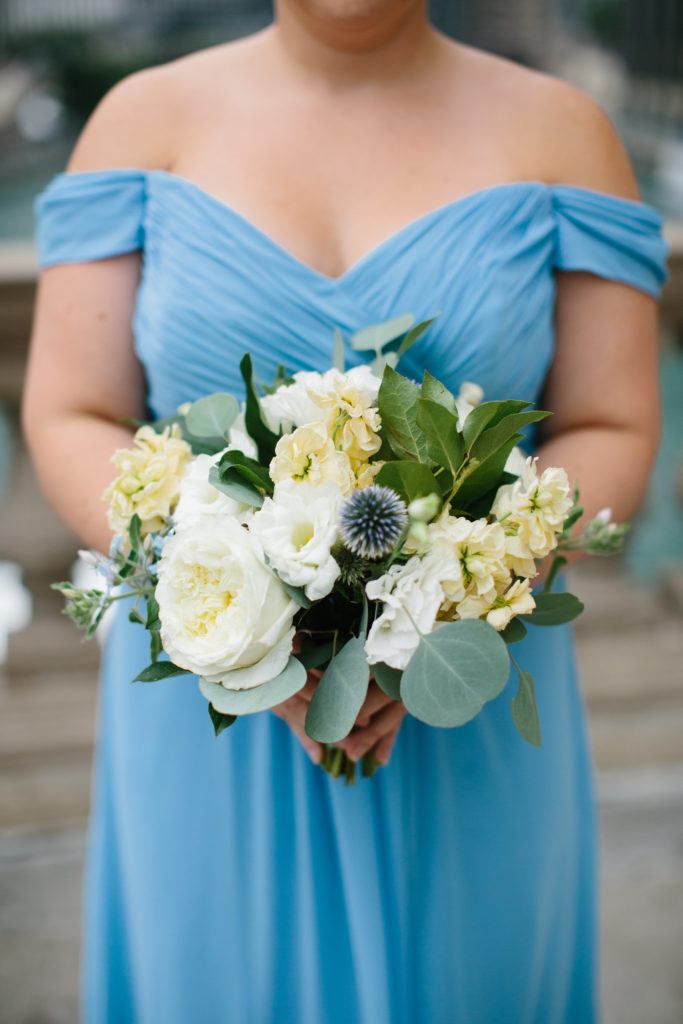 Bridesmaid bouquet for summer wedding at Adler Planetarium with thistle, garden roses, pale yellow stock, tweedia, and eucalyptus.