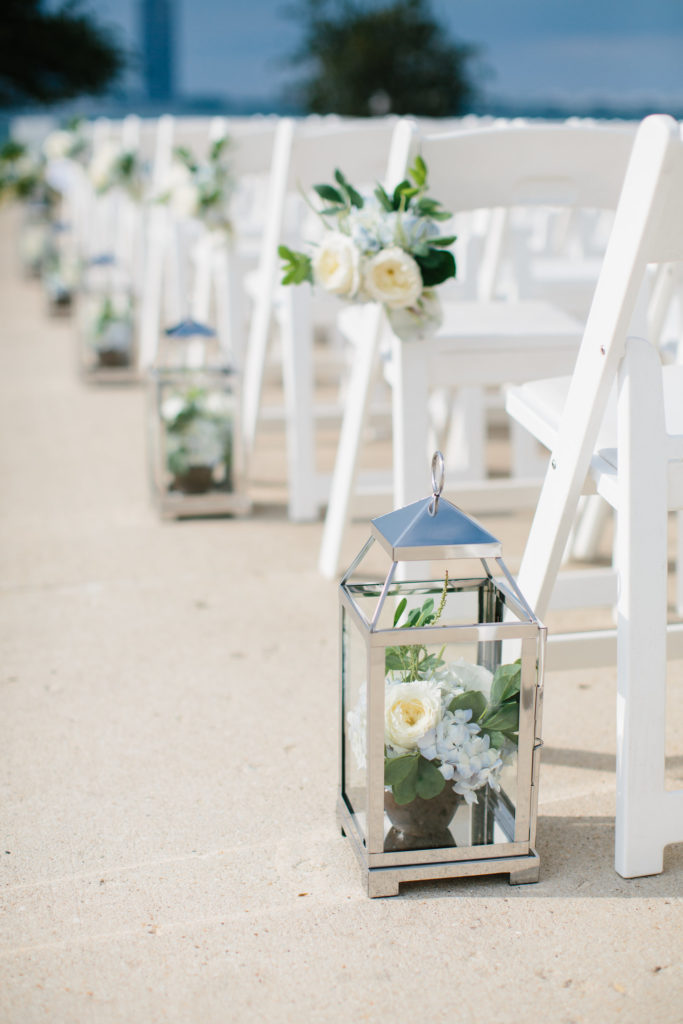 Chair swag on white chair for outdoor July wedding at Adler Planetarium with blue hydrangea and ivory garden roses.