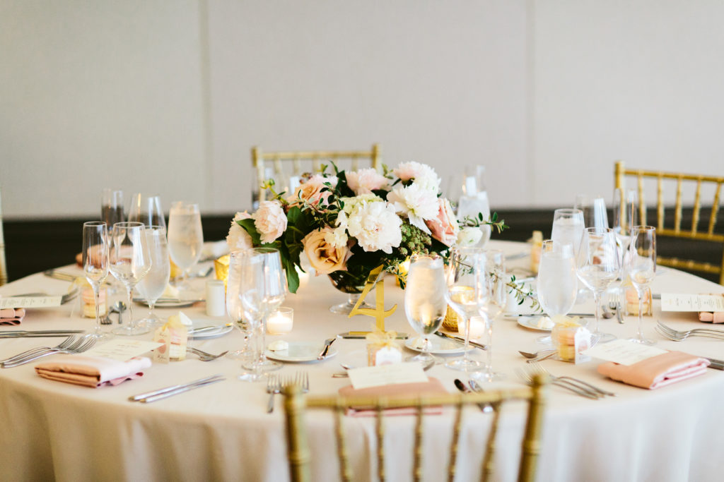 Low arrangement of blush garden roses with ivory and pink peonies for this spring wedding at Londonhouse Chicago.