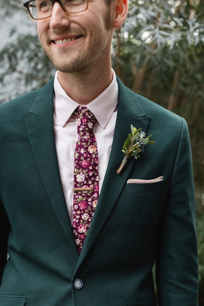 Simple green boutonnière with berries.